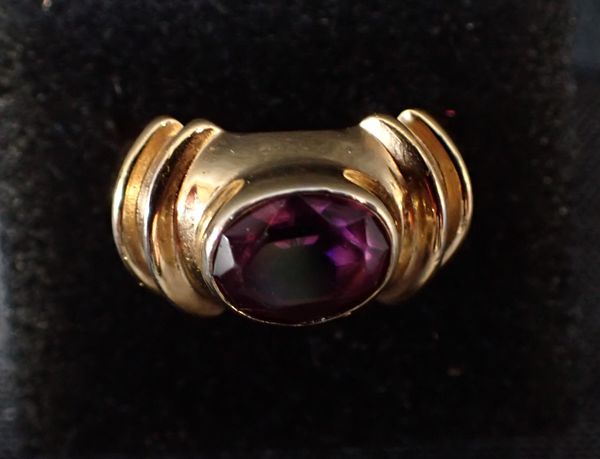 A GOLD PLATED AND AMETHYST RING