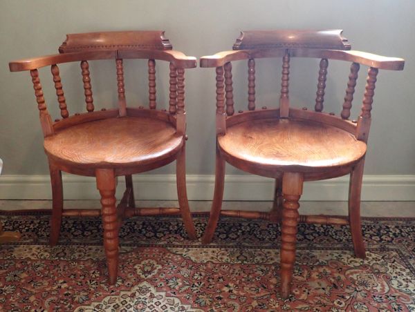 A PAIR OF 19TH CENTURY BEECHWOOD AND ELM CAPTAINS CHAIRS