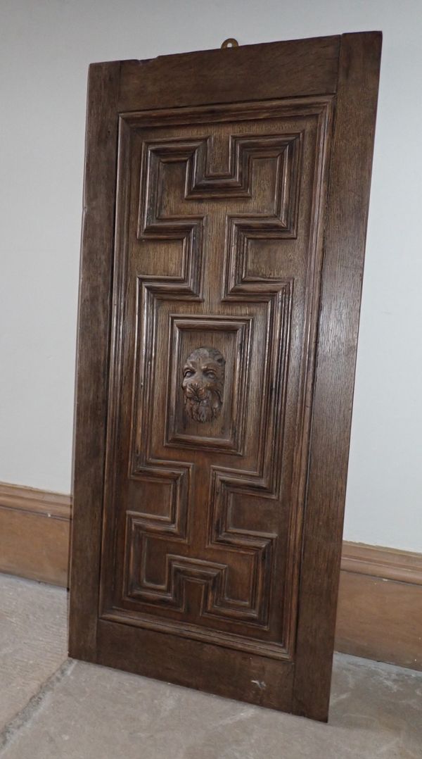 A 19TH CENTURY CARVED OAK PANEL