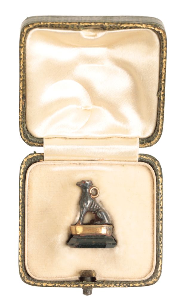 A REGENCY BLOODSTONE FOB IN THE FORM OF A GREYHOUNDS