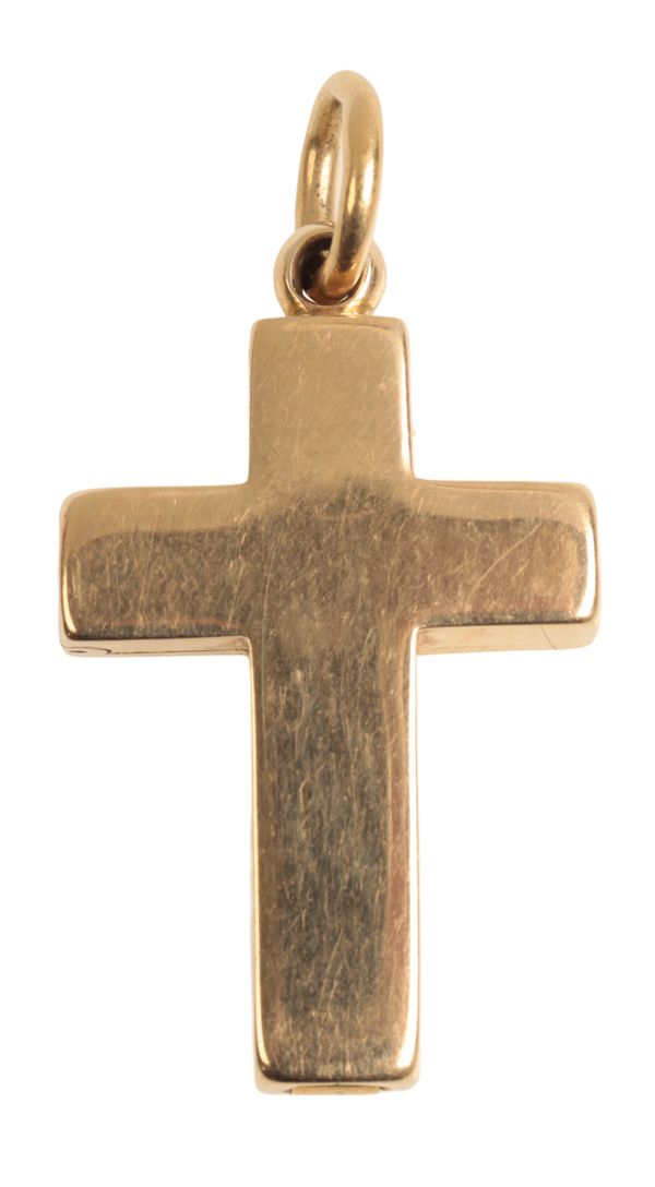 A YELLOW METAL CROSS LOCKET