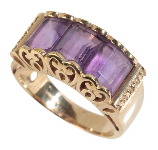 AN AMETHYST THREE STONE DRESS RING