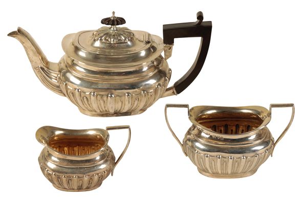 A LATE VICTORIAN SILVER THREE PIECE BACHELORS TEA SERVICE