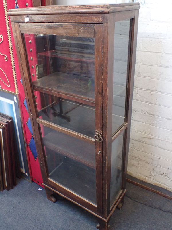 A STAINED PINE DISPLAY CABINET