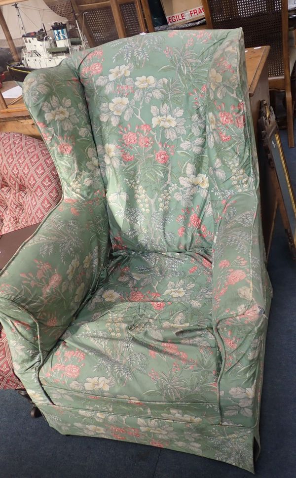 AN EDWARDIAN WING ARMCHAIR