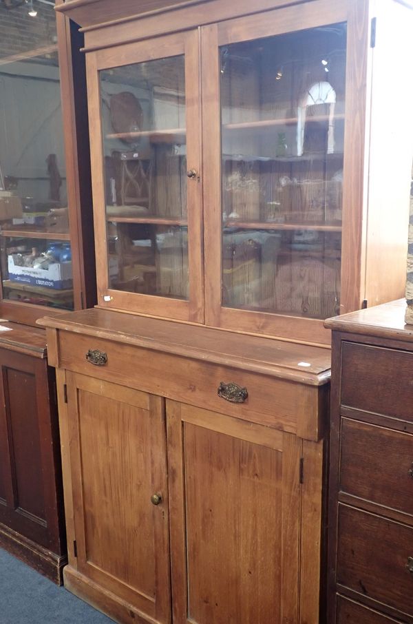 A 19TH CENTURY PINE GLAZED BOOK CASE