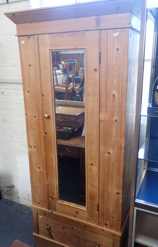 AN EDWARDIAN STRIPPED PINE WARDROBE