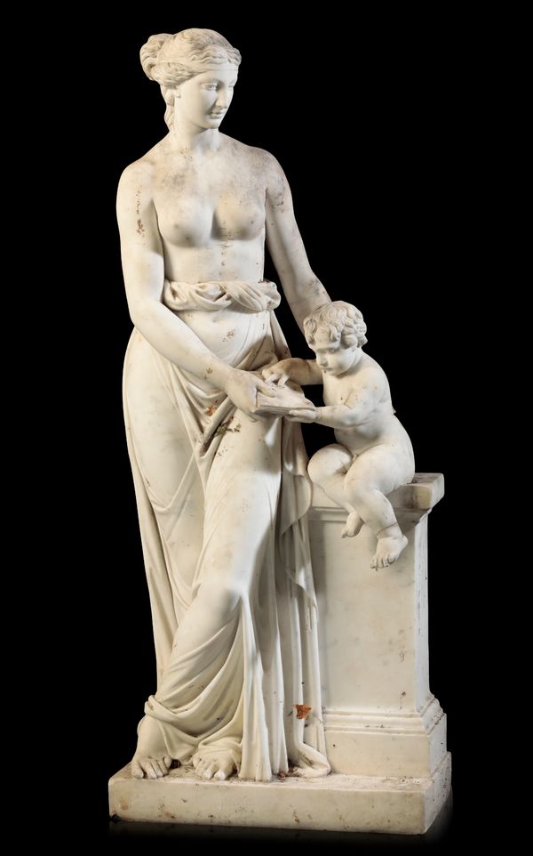 A MARBLE GROUP OF VENUS INSTRUCTING CUPID