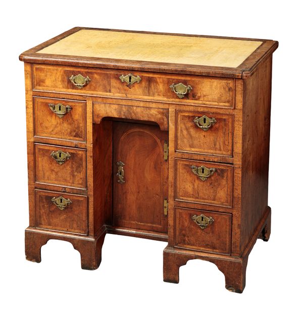 A GEORGE I WALNUT KNEEHOLE DESK