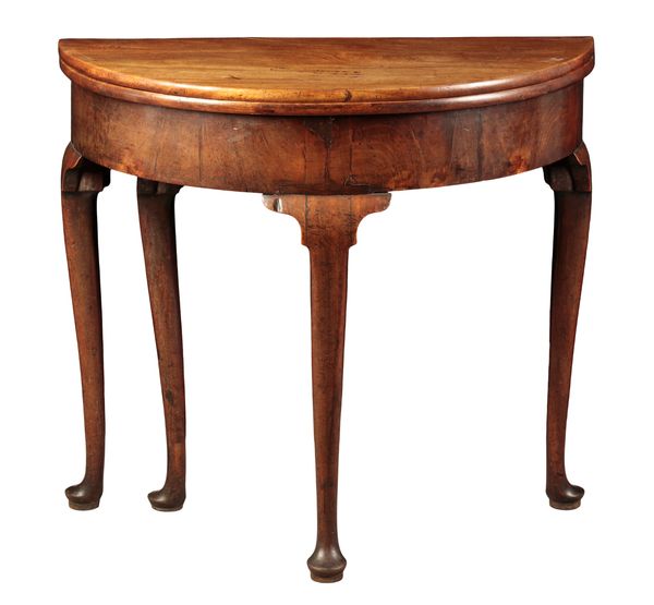 A GEORGE II MAHOGANY DEMI-LUNE TEA TABLE