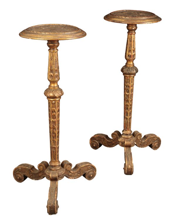 A PAIR OF CARVED AND GILTWOOD TORCHERE STANDS IN THE MANNER OF JAMES MOORE (c.1670-1726)
