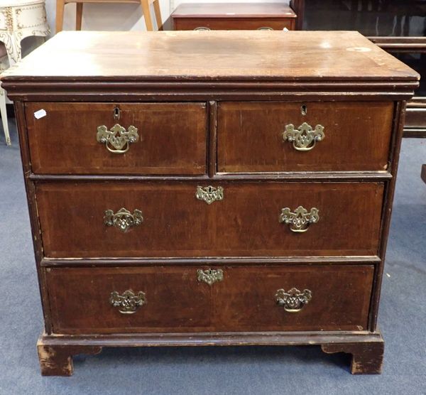 A GEORGE I AND LATER WALNUT CHEST OF DRAWERS