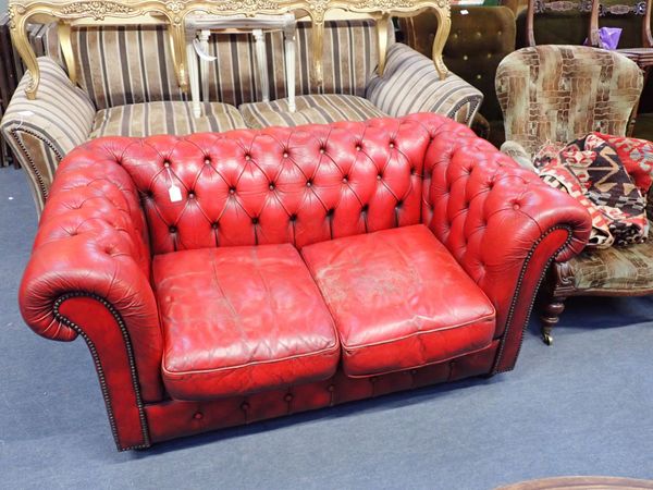 A SMALL CHESTERFIELD SOFA, IN PATINATED RED LEATHER