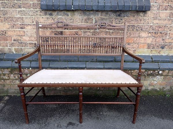 AN EDWARDIAN MAHOGANY FRAMED SETTEE