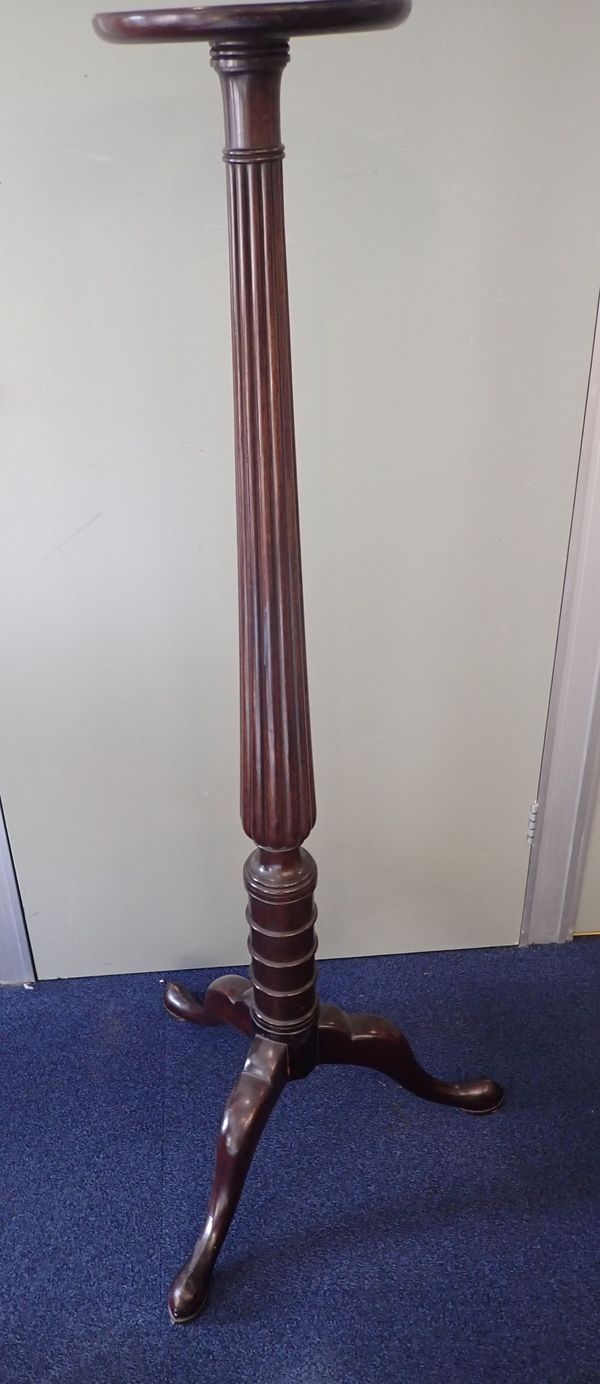 AN EDWARDIAN MAHOGANY TORCHERE