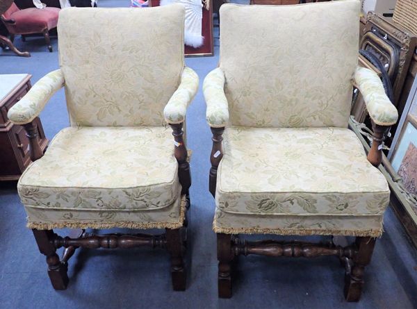 A PAIR OF OAK FRAMED UPHOLSTERED  OPEN ARMCHAIRS