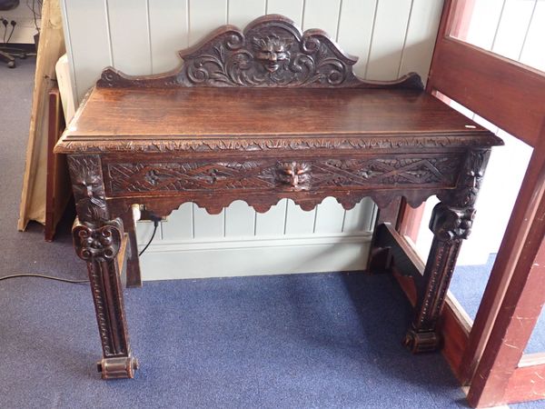 A VICTORIAN CARVED OAK  HALL TABLE