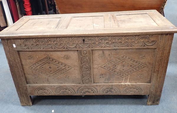 AN OAK COFFER, WITH TWO-PANEL FRONT