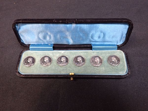 A BOXED SET OF SILVER BUTTONS