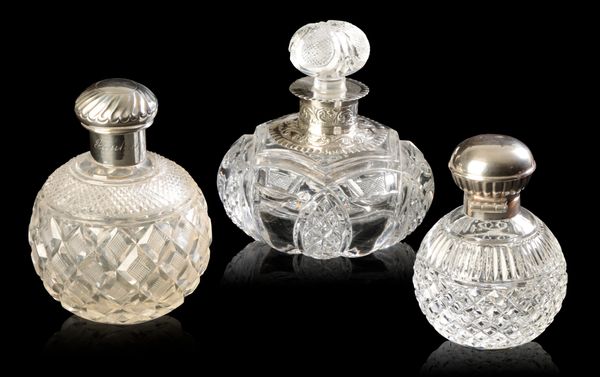 THREE SILVER MOUNTED DRESSING TABLE BOTTLES