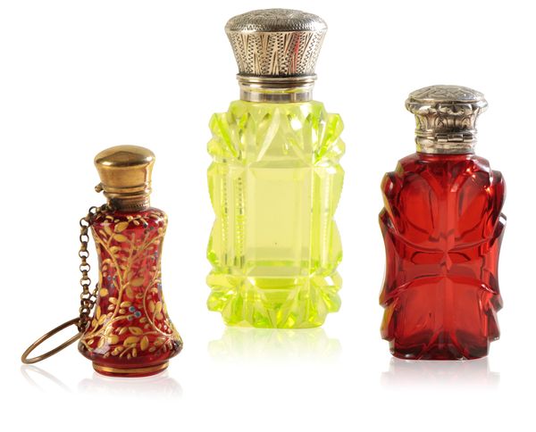 THREE COLOURED GLASS SCENT BOTTLES