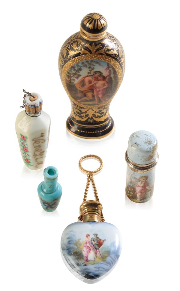 A GROUP OF FIVE GLASS AND PORCELAIN SCENT BOTTLES