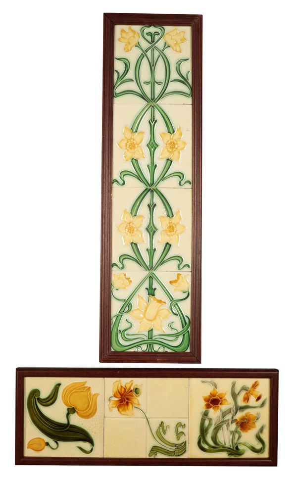 A FRAMED SET OF THREE PARTIAL RELIEF ART NOUVEAU FLORAL TILES