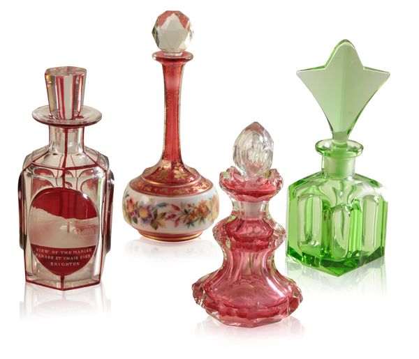 A BOHEMIAN CRANBERRY GLASS FLORAL ENAMELLED SCENT BOTTLE