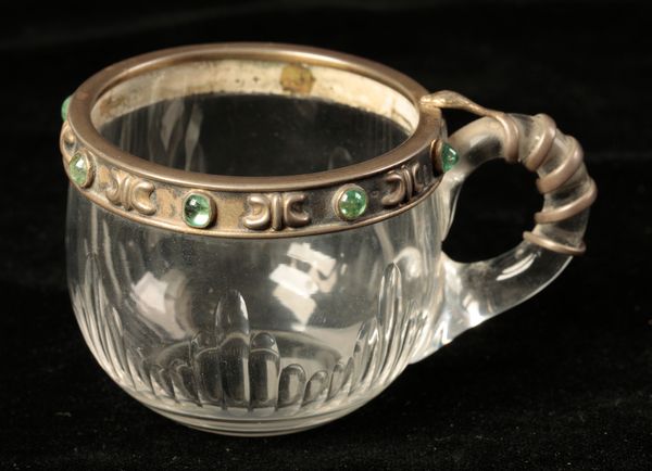 A RUSSIAN SILVER AND EMERALD SET PUNCH GLASS
