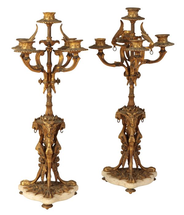 A PAIR OF REGENCY STYLE GILT METAL FIVE LIGHT CANDELABRA