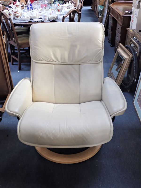 A 'STRESSLESS' CREAM LEATHER CHAIR