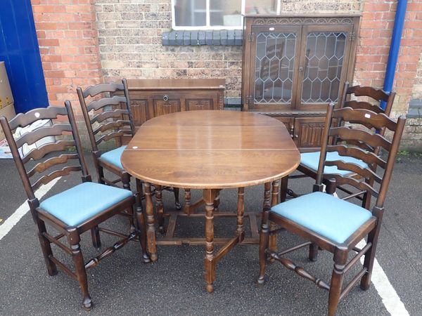 A JACOBEAN STYLE DINING SUITE