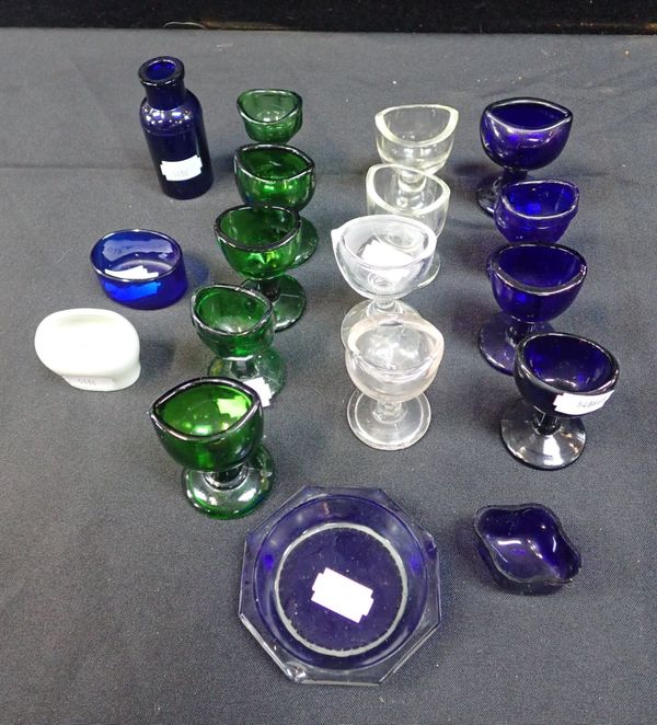 A COLLECTION OF GLASS  EYE BATHS