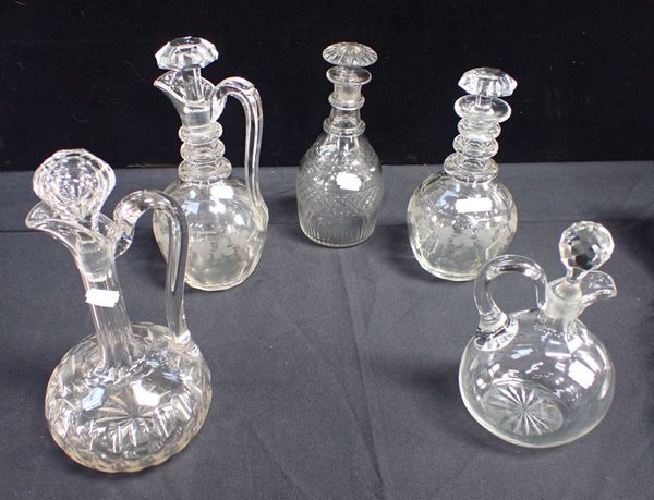 A GROUP OF FIVE CUT GLASS DECANTERS