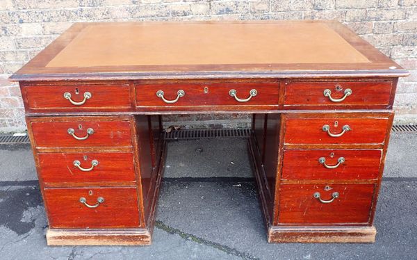 A STAINED OAK PEDESTAL DESK