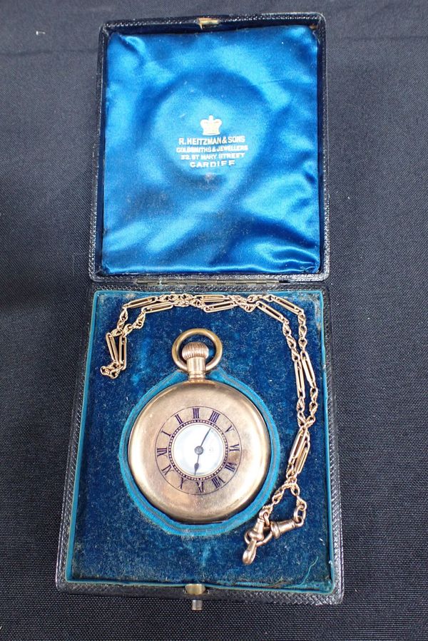 A HALF HUNTER GOLD PLATED POCKET WATCH AND CHAIN