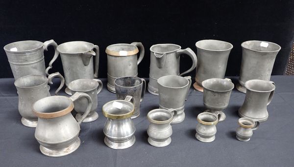 A COLLECTION OF PEWTER TANKARDS AND JUGS