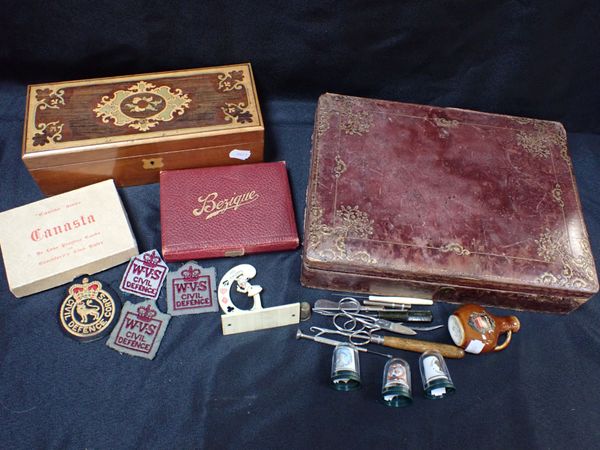 A TOOLED LEATHER BOX AND A MARQUETRY BOX