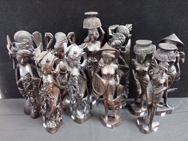 A COLLECTION OF BALINESE CARVED HARDWOOD FIGURES