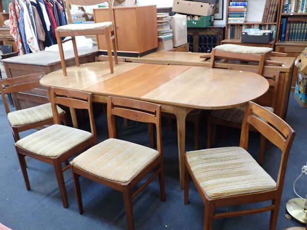 A MID-CENTURY MODERN TEAK DINING SUITE, THE TABLE STAMPED 'NATHAN FURNITURE'