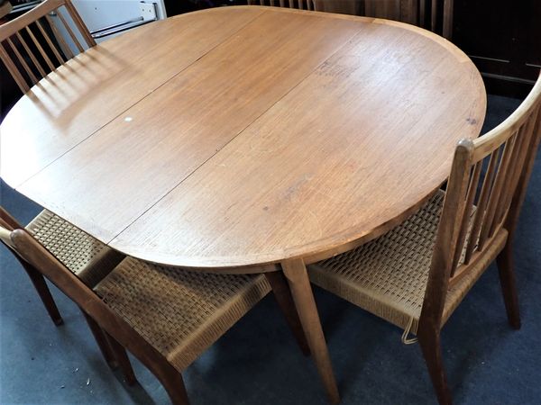 A MID-CENTURY MODERN TEAK DINING TABLE AND SIX CHAIRS