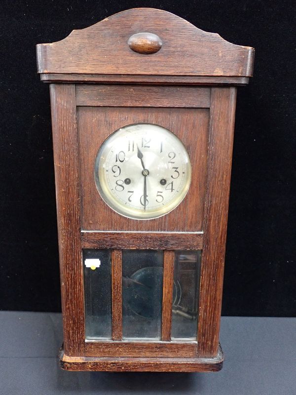 A 1930S OAK WALL CLOCK