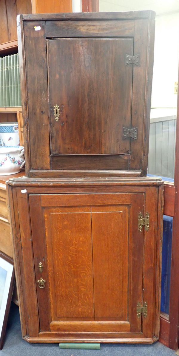 A GEORGE III OAK CORNER CUPBOARD