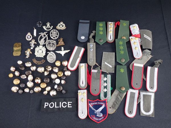 A COLLECTION OF  MILITARY BADGES