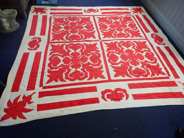 A RED AND WHITE PATCHWORK QUILT, POSSIBLY AMERICAN