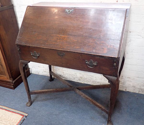 A GEORGE II COUNTRY OAK BUREAU, REPUTEDLY USED BY NAPOLEON