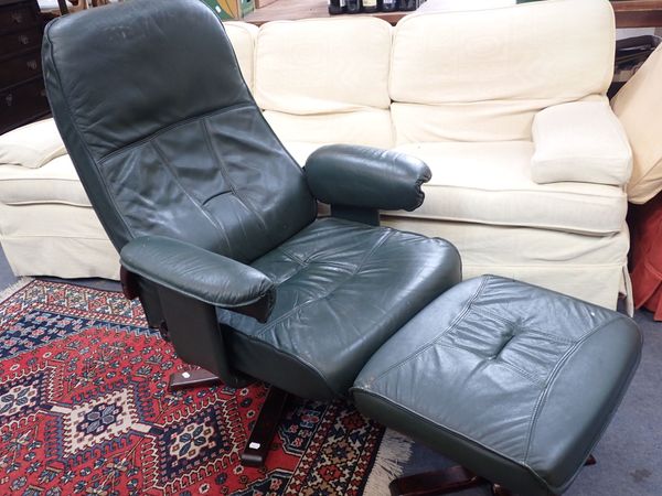 A UNICO DANISH RECLINER CHAIR AND FOOTSTOOL