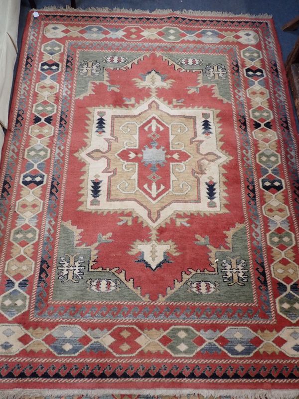 A PINK GROUND RUG, WITH GEOMETRIC DESIGN