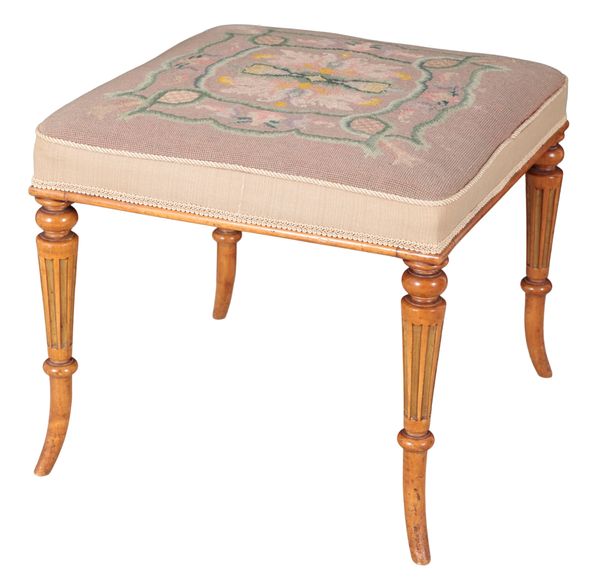 A REGENCY STYLE SATINWOOD AND PARCEL GILT STOOL