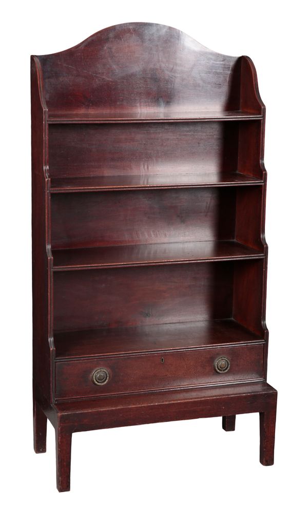 A REGENCY MAHOGANY WATERFALL BOOKCASE